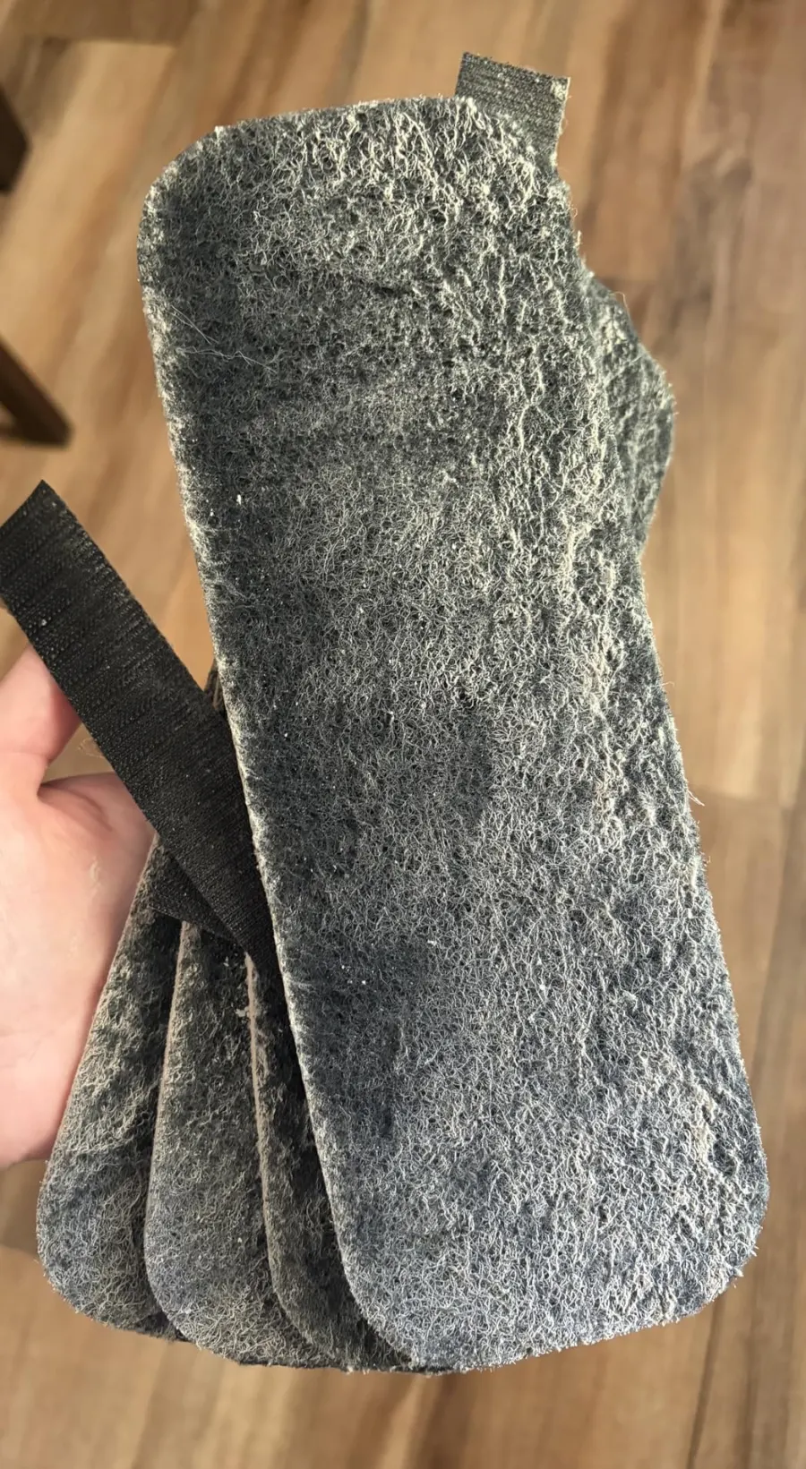 Stack of used filter pads full of dust